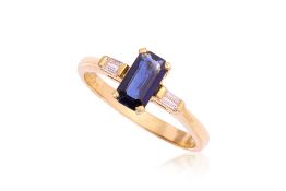 A SAPPHIRE AND DIAMOND THREE STONE RING