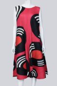 PLEATS PLEASE ISSEY MIYAKE - A RED RECORD PRINT PLEATED SWING DRESS