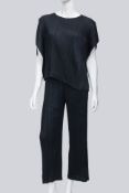 PLEATS PLEASE ISSEY MIYAKE - A BLACK PLEATED TOP AND TROUSERS SET