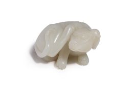 A WHITE JADE CARVING OF A DOG
