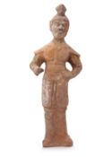 A LARGE POTTERY FIGURE OF A WARRIOR