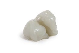 A PALE CELADON JADE MODEL OF A RAM