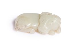 A PALE CELADON JADE CARVING OF AN OX