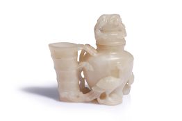 A CARVED WHITE JADE NATURALISTIC VASE AND COVER