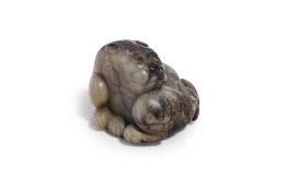A JADE CARVING OF A MYTHICAL BEAST