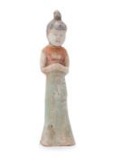 A PAINTED POTTERY FIGURE OF A COURT LADY