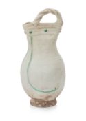 A WHITE AND GREEN-GLAZED POTTERY EWER