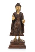 A SINO-TIBETAN BRONZE BUDDHA AND STAND