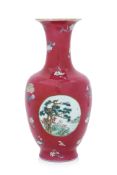 A RUBY-GROUND FAMILLE ROSE MEDALLION VASE