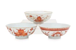 A GROUP OF THREE IRON RED DECORATED 'SANDUO' BOWLS