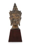 A THAI GILT-BRONZE HEAD OF BUDDHA