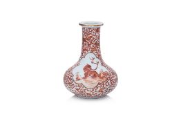 AN IRON RED 'MYTHICAL BEAST' DECORATED BOTTLE VASE