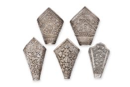 A GROUP OF FIVE SILVER BETEL LEAF HOLDERS