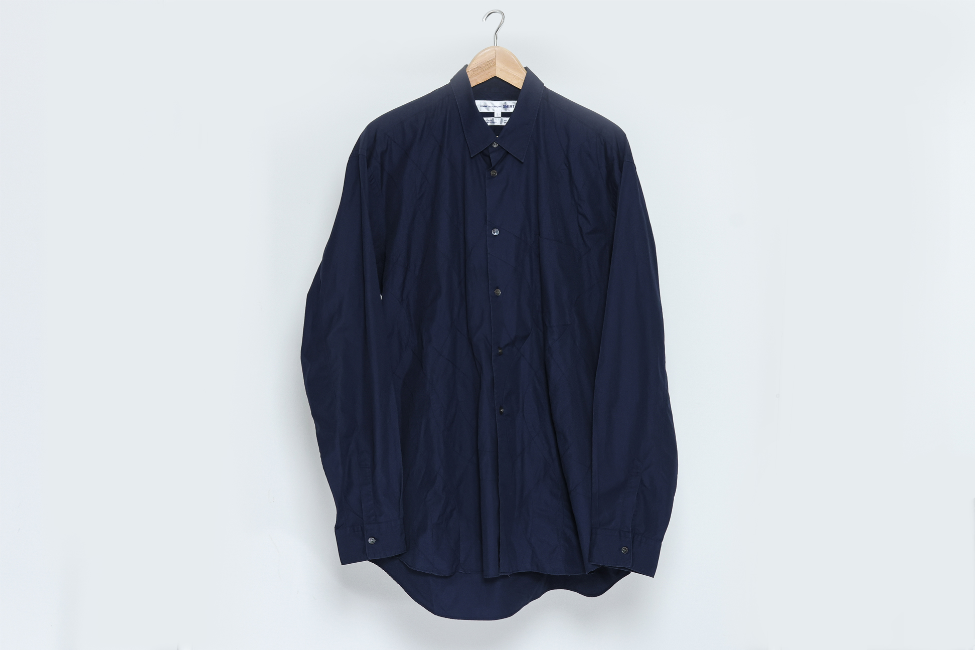 COMME DES GARÇONS SHIRT - A MEN'S BUTTON UP SHIRT WITH QUILTED DETAILS