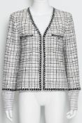 CHANEL - A 'FANTASY' TWEED PLUNGE NECK JACKET WITH CUFF INSERTS, RESORT 2024 LOOK 24