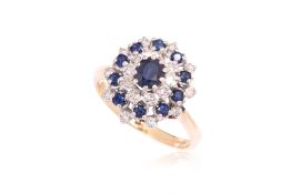 A SAPPHIRE AND DIAMOND CLUSTER RING