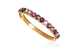 A MULTI-COLOURED GEMSTONE BANGLE