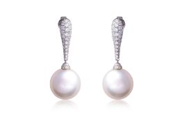 A PAIR OF SOUTH SEA CULTURED PEARL AND DIAMOND 'DROP' EARRINGS