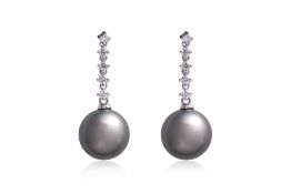 A PAIR OF TAHITIAN SOUTH SEA CULTURED PEARL AND DIAMOND EARRINGS