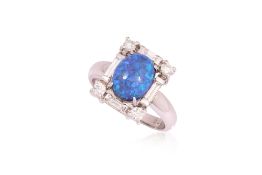 A BLACK OPAL AND DIAMOND RING