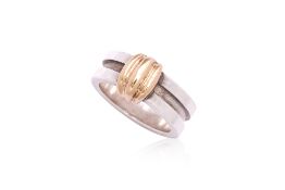 A TWO TONE 'ATLAS GROOVE' RING BY TIFFANY & CO.