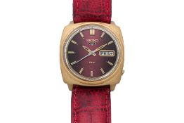 SEIKO - A DX AUTOMATIC WRISTWATCH WITH RED DIAL