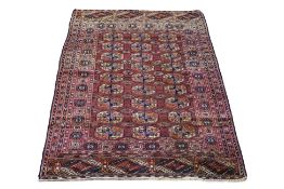 A TURKMEN BOKHARA WOOL RUG (190 X 123CM)