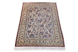 A PERSIAN FLORAL WOOL RUG (180 X 120CM)