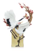 A LARGE FRANZ PORCELAIN CRANES AND BLOSSOM SCULPTURE
