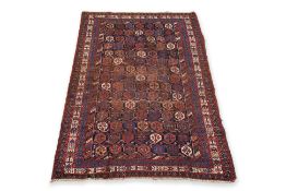 AN ANTIQUE KURDISH BOTEH DESIGN WOOL RUG (218 X 132CM)