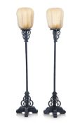 A PAIR OF CARVED AND BLACK PAINTED WOODEN LANTERNS