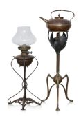 AN ARTS AND CRAFTS BRASS AND COPPER KETTLE ON STAND BY W.A.S. BENSON, PLUS A SIMILAR OIL LAMP