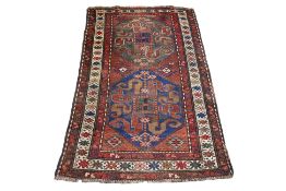 AN ANTIQUE CAUCASIAN WOOL RUG (222 X 124CM)