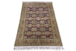 A PERSIAN FLORAL MEDALLION WOOL RUG (190 X 123CM)