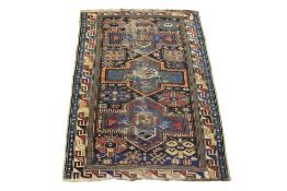 A CAUCASIAN GEOMETRIC WOOL RUG (152 X 100CM)