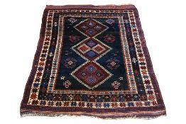 A TRIBAL KURDISH WOOL RUG (170 X 128CM)