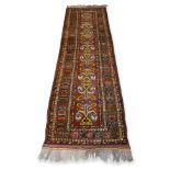 AN ANTIQUE PERSIAN WOOL RUNNER (330 X 88CM)