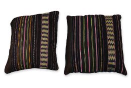 A PAIR OF WOOL SADDLE BAG FACES CONVERTED TO CUSHION COVERS