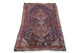 A QASHQAI WOOL RUG WITH ANIMAL MOTIFS (217 X 126CM)