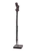 A DAYAK CARVED WOOD 'TUN-TUN' PIG STICK