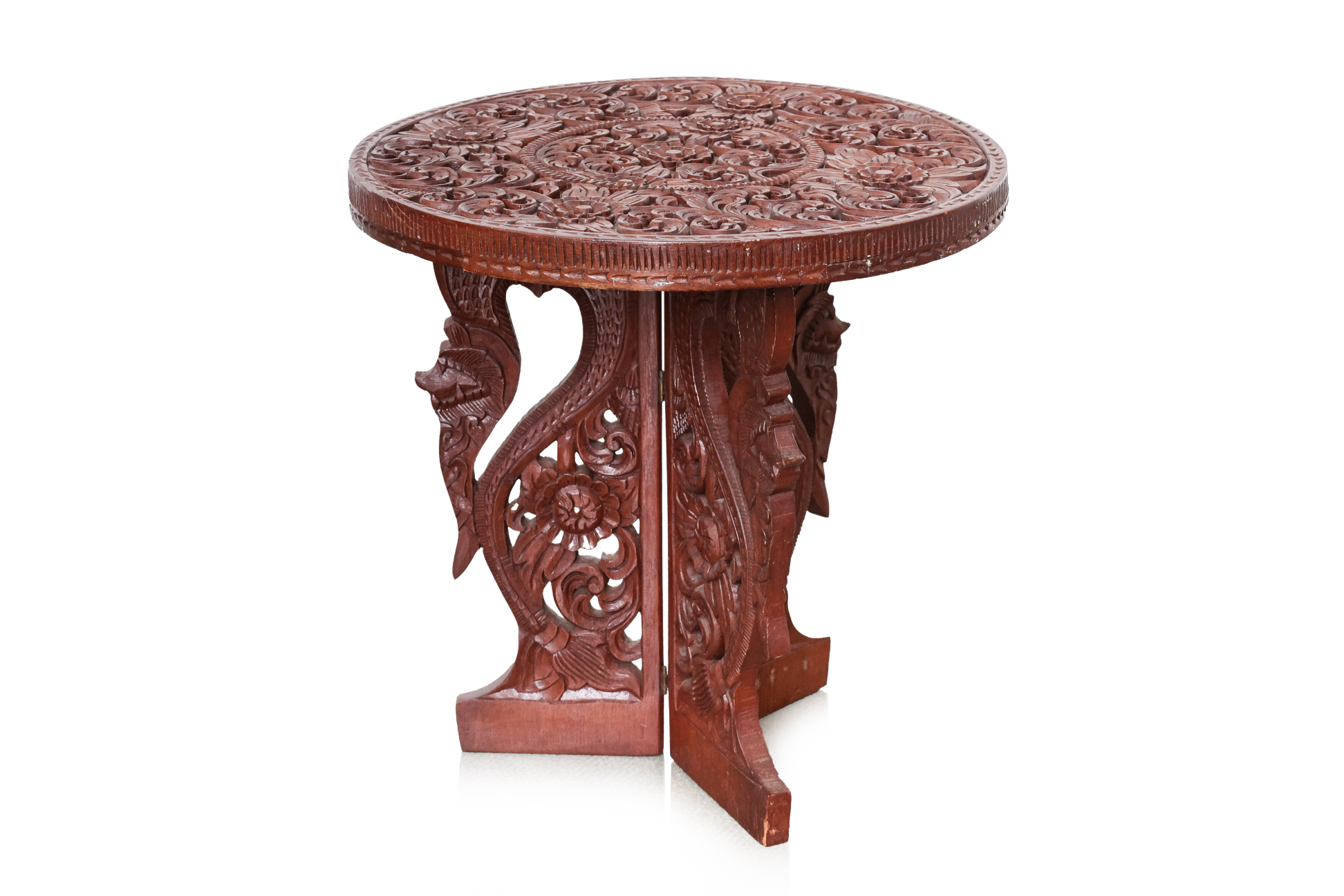 AN INDONESIAN CARVED TEAK SIDE TABLE