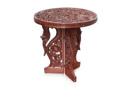 AN INDONESIAN CARVED TEAK SIDE TABLE