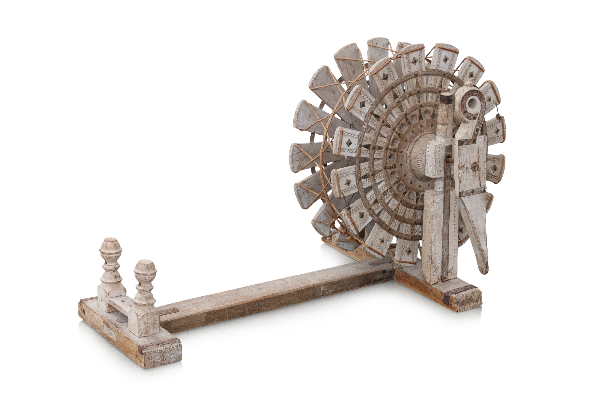 AN INDIAN CARVED WOOD SPINNING WHEEL