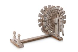 AN INDIAN CARVED WOOD SPINNING WHEEL