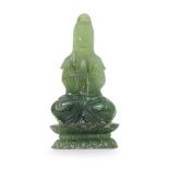 A SERPENTINE JADE FIGURE OF GUAN YIN