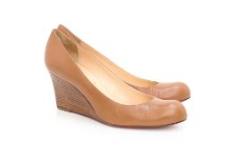 CHRISTIAN LOUBOUTIN - A PAIR OF TAN LEATHER WEDGE SHOES