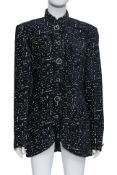 VERSUS GIANNI VERSACE - A BLACK AND WHITE FLECKED JACKET, C. 1990S
