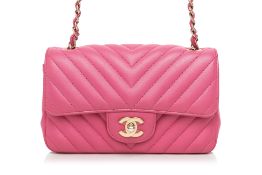 CHANEL - A PINK CHEVRON FLAP MINI BAG