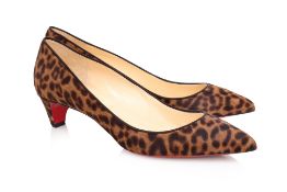 CHRISTIAN LOUBOUTIN - A PAIR OF LEOPARD PRINT POINTED TOE PUMPS