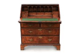 A GEORGE II WALNUT AND FEATHERBANDED BUREAU